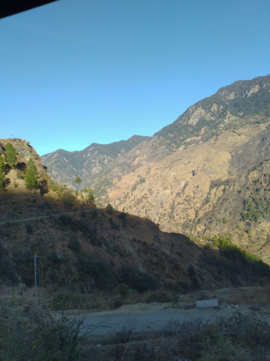 Mountain valley road on the way back from Kedarkantha